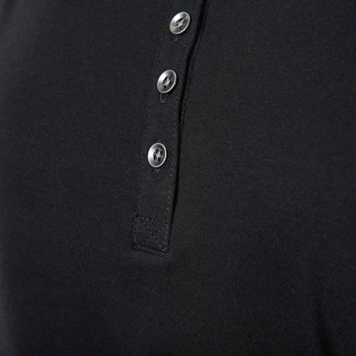 Close-up of a black henley shirt showcasing a textured fabric four metallic buttons and subtle stitching detail