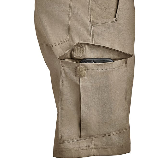 Product shot showing tan tactical pants with multiple pockets including a Velcro-secured cell phone pocket a large cargo pocket and a smaller utility pocket featuring subtle stitching detail