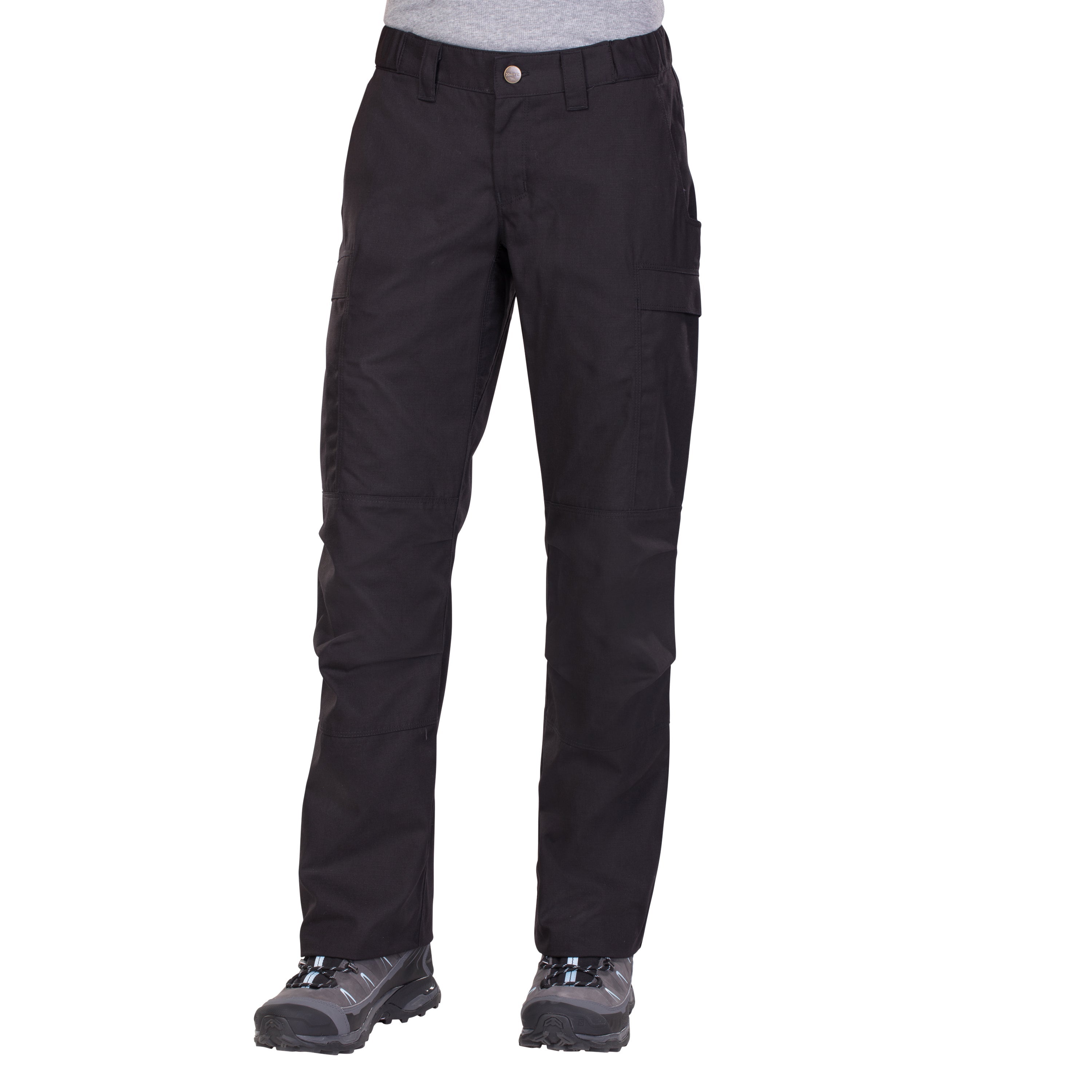 Product shot of black tactical pants and gray hiking boots featuring a button fly, cargo pockets, and light blue laces