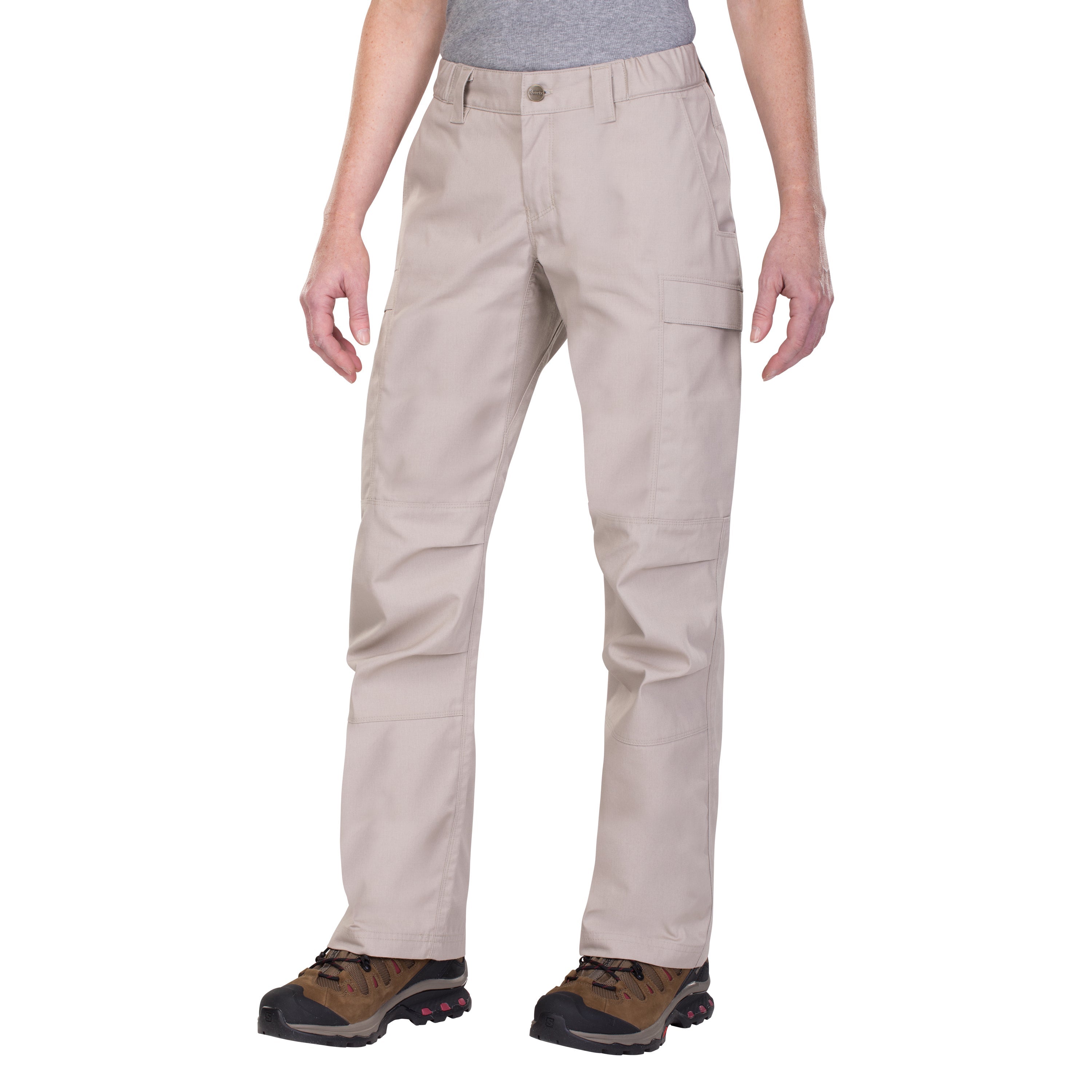 Product shot of beige tactical pants with two cargo pockets and brown hiking boots featuring red accents and sturdy soles against a white background