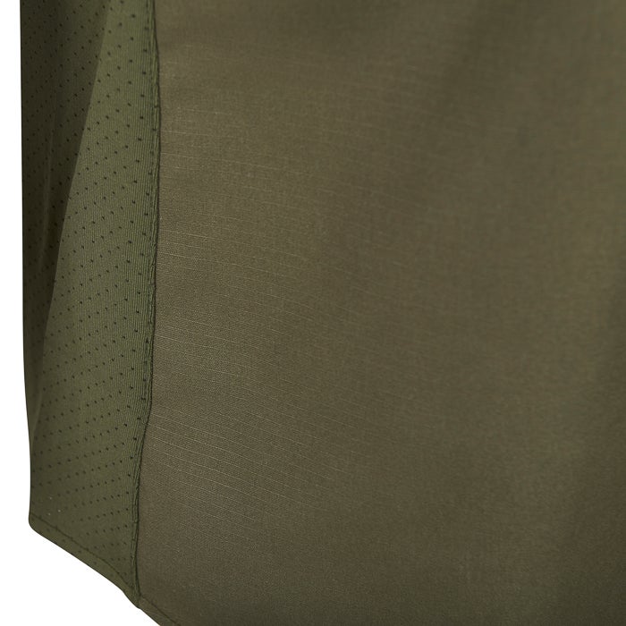 Close-up detail of olive green fabric showing a textured surface, a contrasting perforated panel, and subtle stitching details