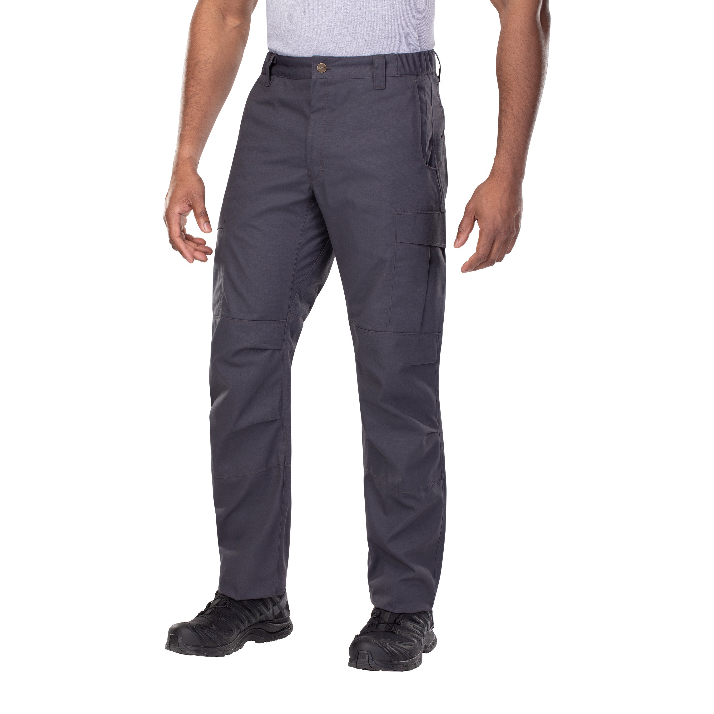 Product shot of dark gray tactical pants on a model showing the reinforced knees and multiple pockets against a white background