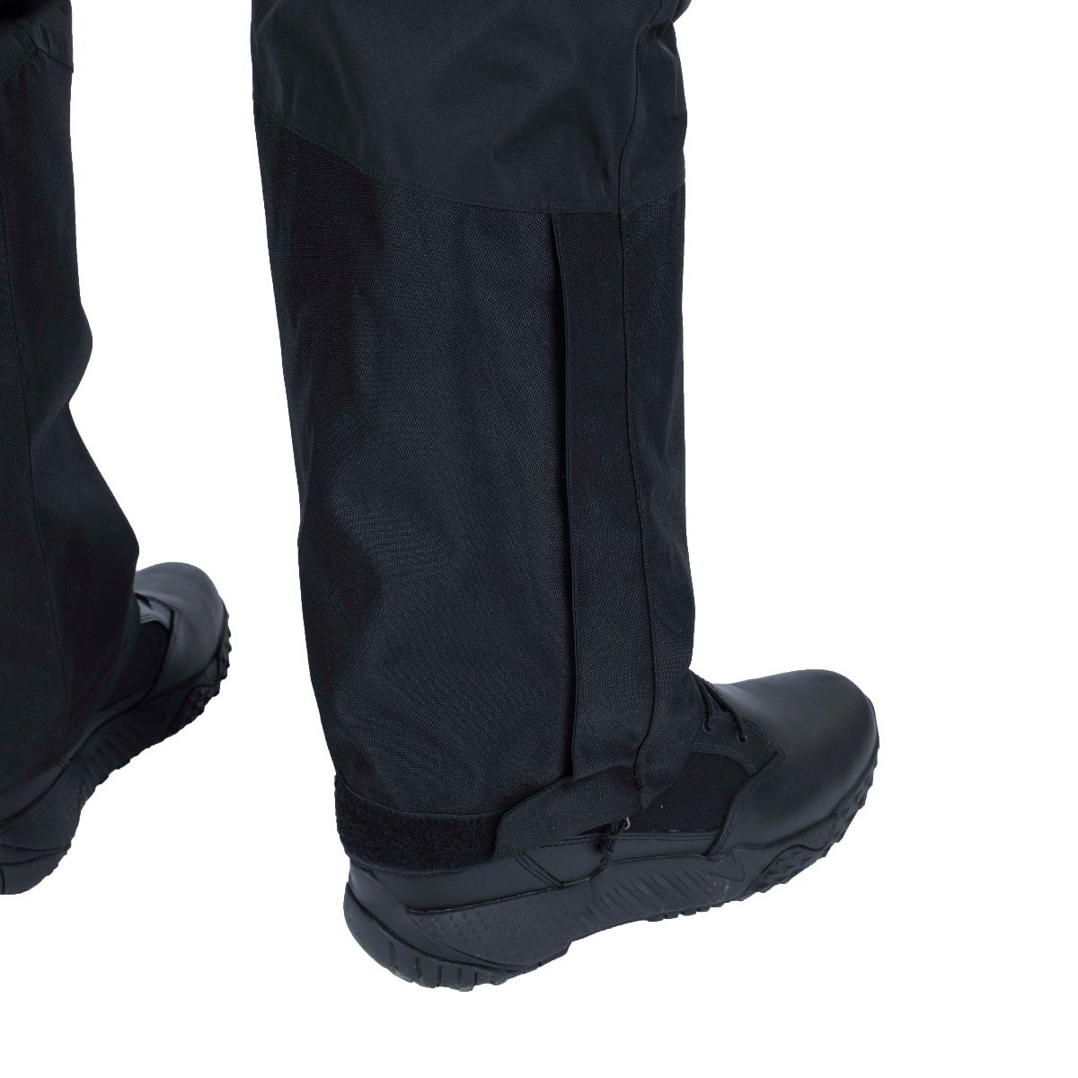 Product shot showing black tactical pants with gaiters and boots featuring adjustable straps and a textured sole