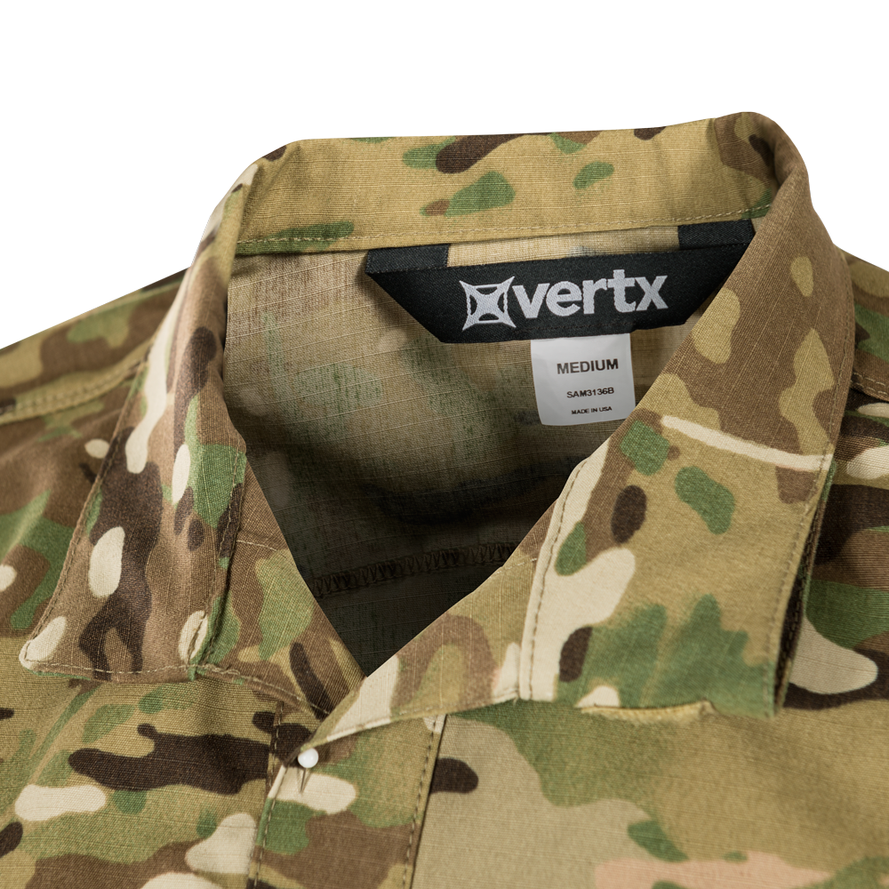 Product shot of a Vertx medium shirt in MultiCam camouflage featuring a black label tan stitching and subtle texture details