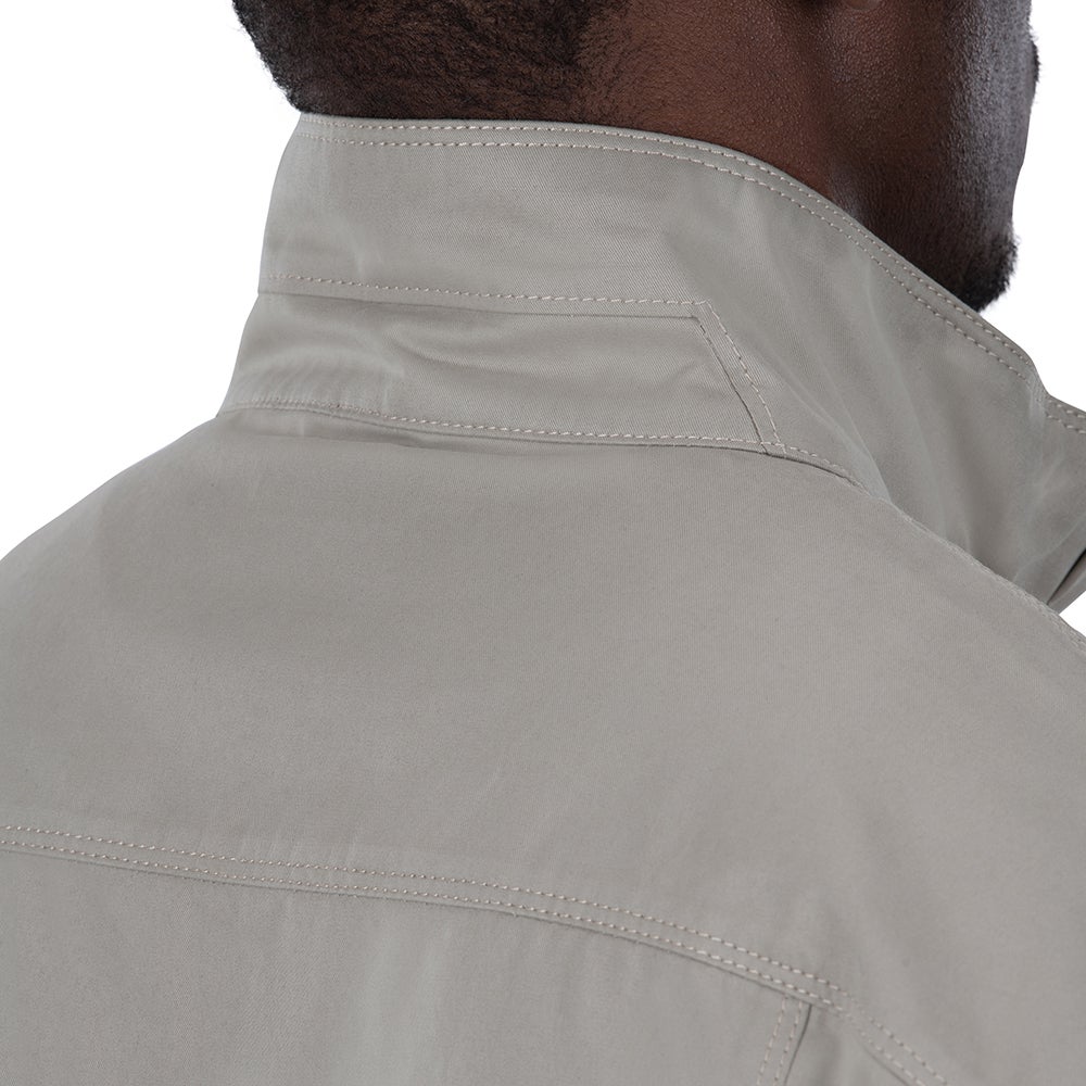 Close-up photograph of a light grey shirt collar showing subtle stitching details and a textured fabric